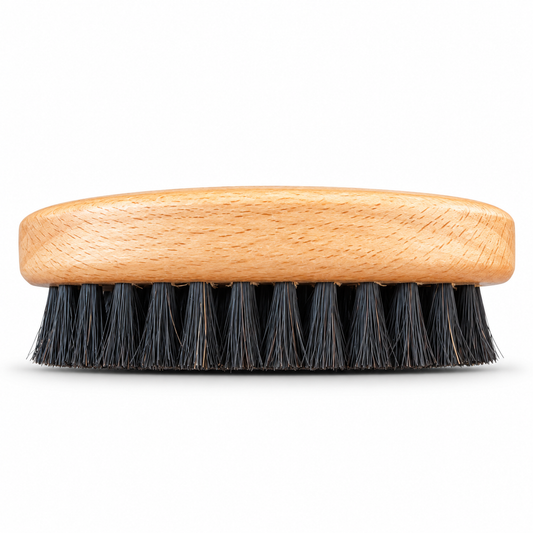 Beard brush side view showing firm black bristles and beech wood base