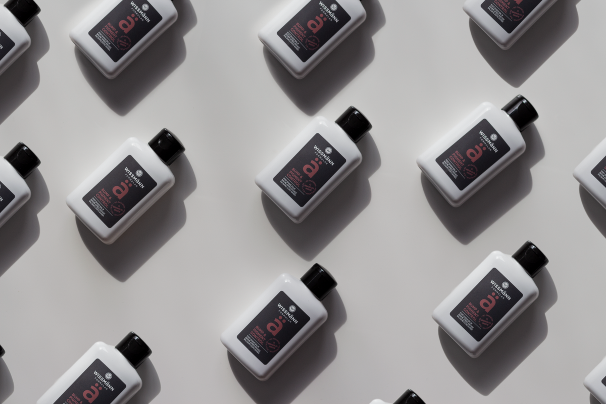 Wissmann Formular Bump & Pigment Control Post-Shave Balm bottles arranged in a pattern