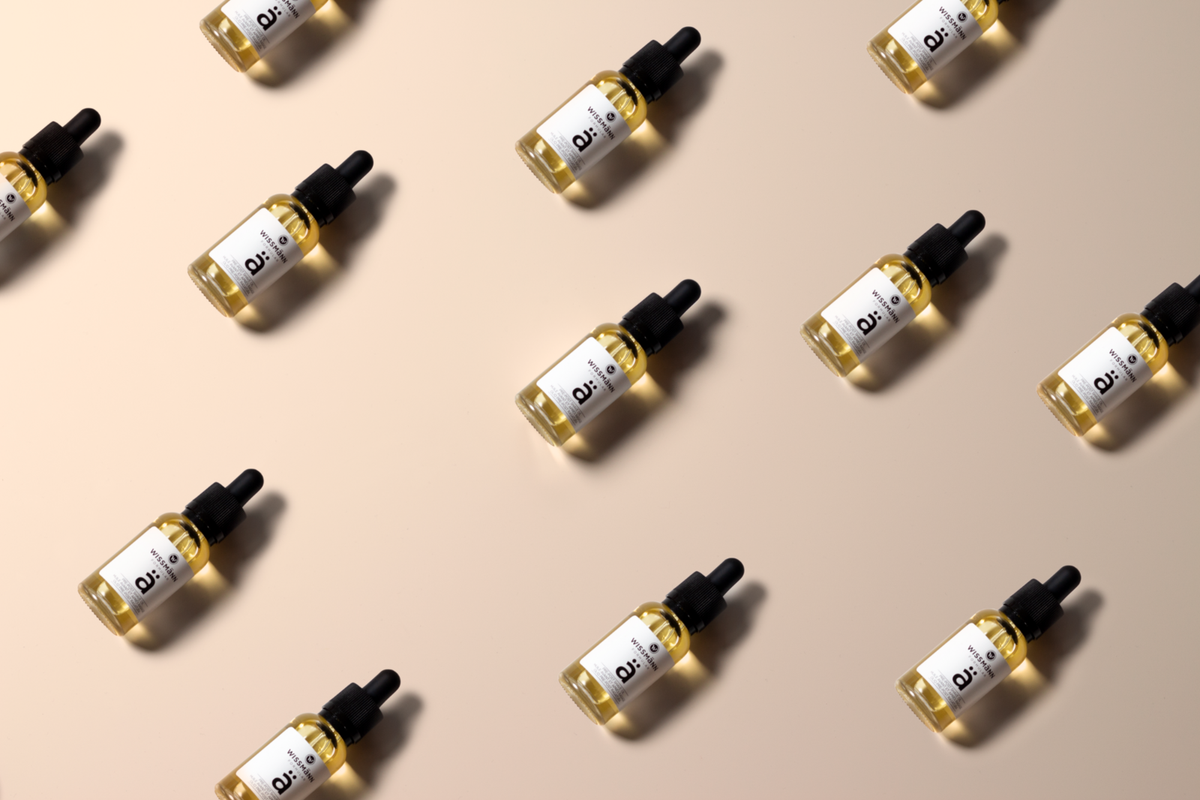 Wissmann Formular Pre & Post-Shave Oil dropper bottles arranged in a pattern